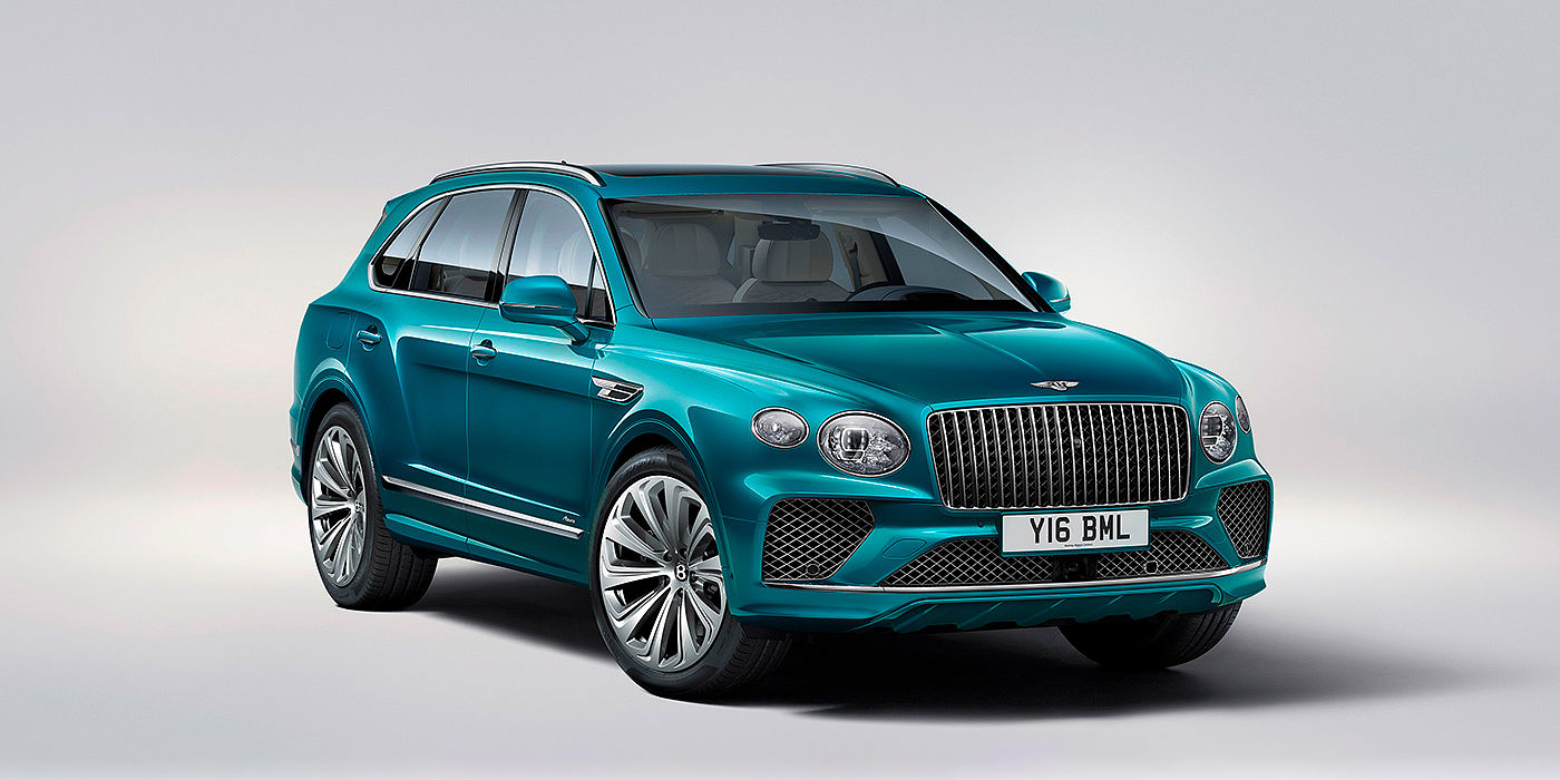 Bentley New Delhi Bentley Bentayga Azure front three-quarter view, featuring a fluted chrome grille with a matrix lower grille and chrome accents in Topaz blue paint.