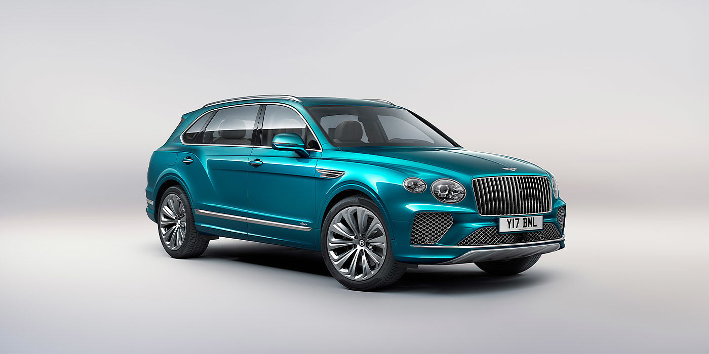 Bentley New Delhi Bentley Bentayga EWB Azure front three-quarter view, featuring a fluted chrome grille with a matrix lower grille and chrome accents in Topaz blue paint.