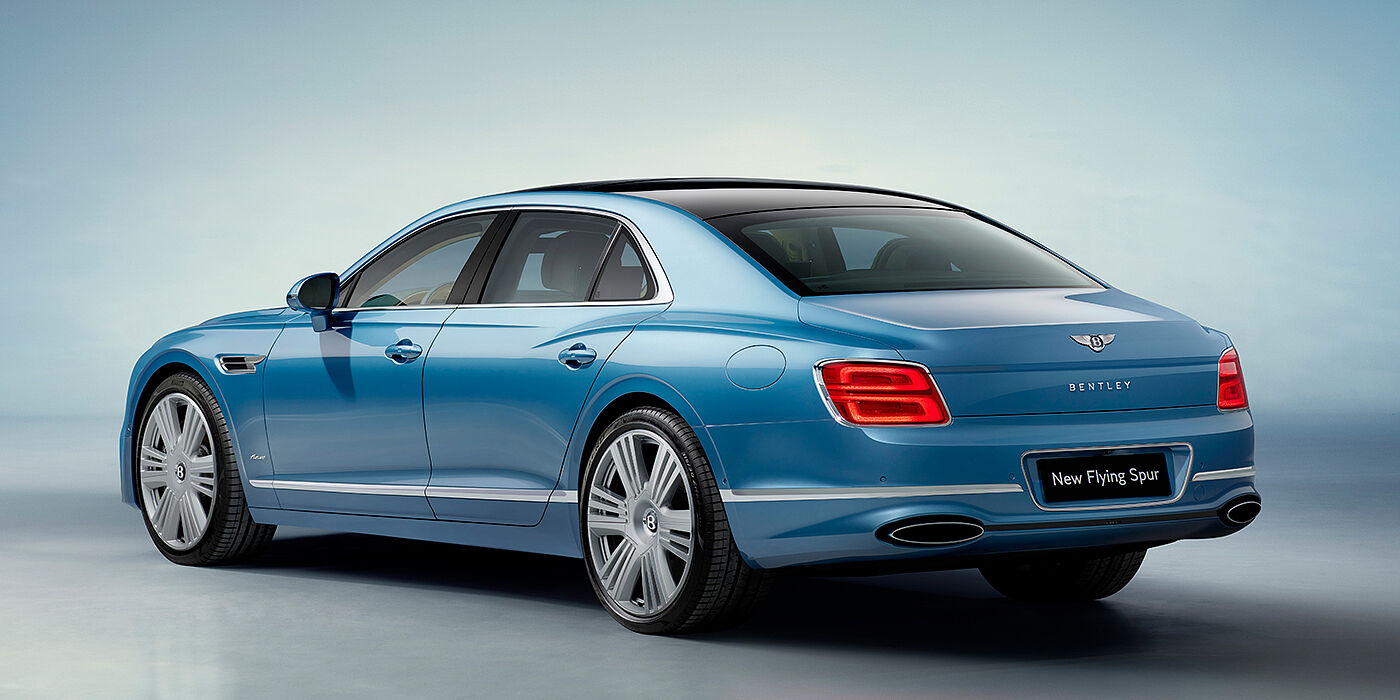 Bentley New Delhi New Bentley Flying Spur Azure sedan rear view in Light windsor blue by Mulliner paint with 22 inch Azure wheels and chrome exterior details