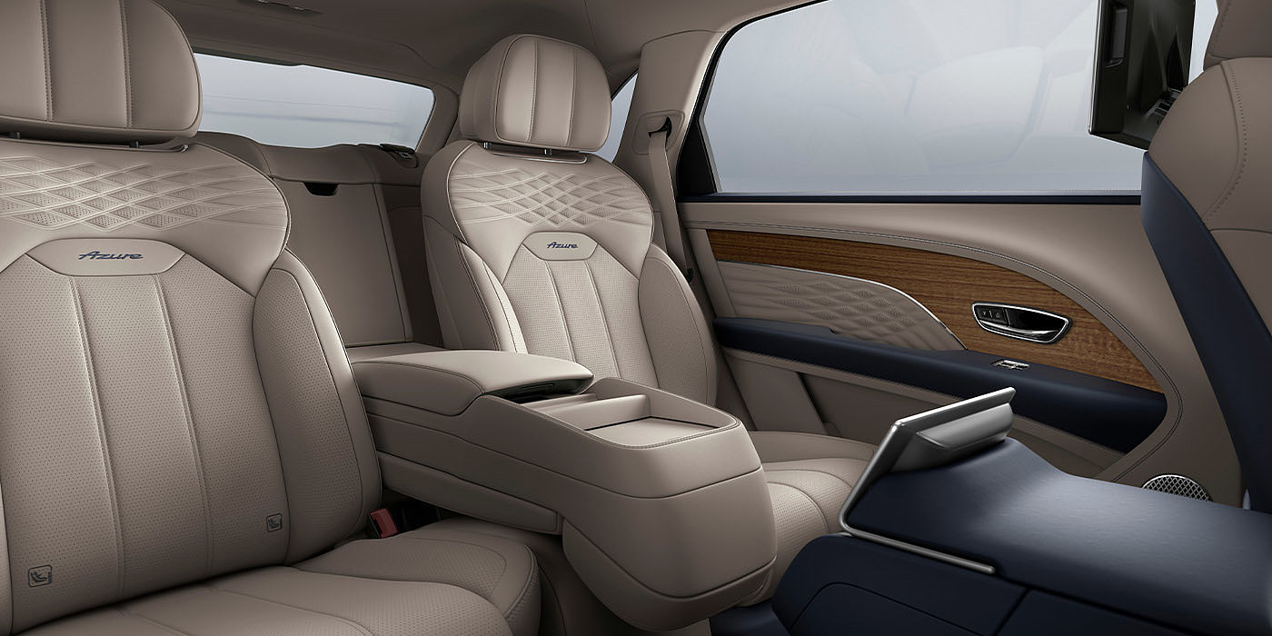 Bentley New Delhi Bentley Bentayga EWB Azure interior view for rear passengers with Portland hide featuring Azure Emblem in Imperial Blue contrast stitch.