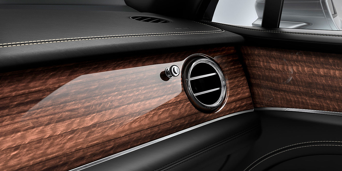 Bentley New Delhi Bentley Bentayga front interior Crown Cut Walnut veneer and chrome air vent.