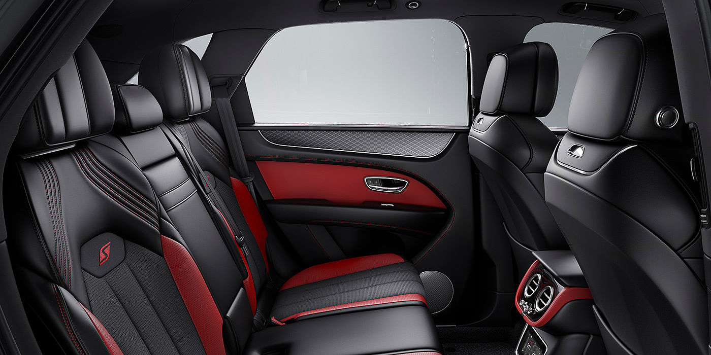 Bentley New Delhi Bentey Bentayga S interior view for rear passengers with Beluga black and Hotspur red coloured hide.