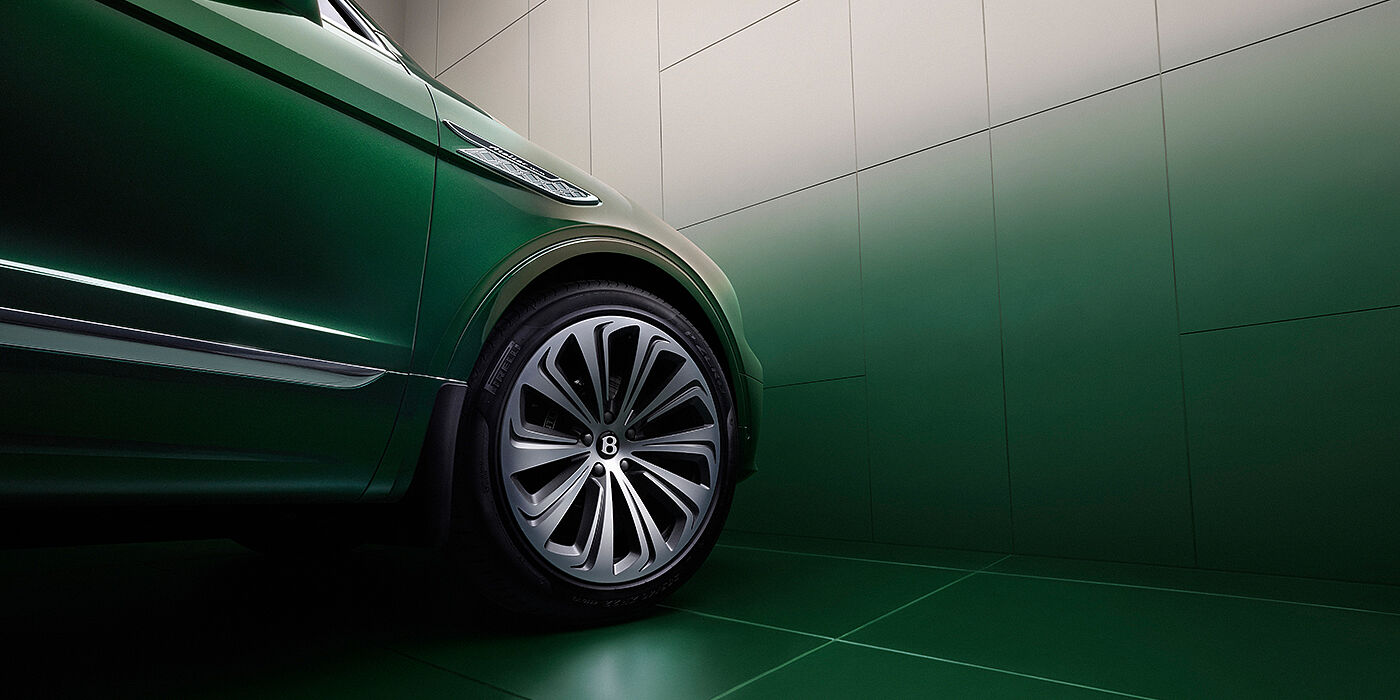 Bentley New Delhi Bentley Bentayga Extended Wheelbase Atelier Edition SUV in Light Emerald green paint front side detail with 22 inch 10 spoke wheel