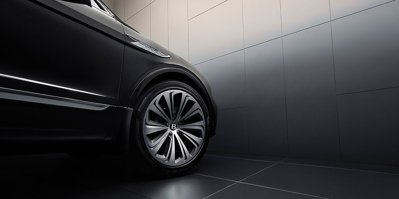 Bentley New Delhi Bentley Bentayga Atelier Edition SUV in Onyx black paint front side detail with 22 inch 10 spoke wheel