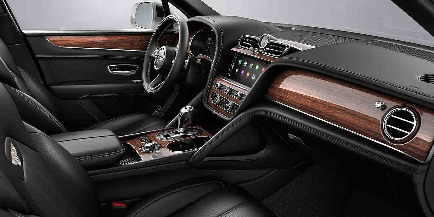 Bentley New Delhi Bentley Bentayga EWB interior with a Crown Cut Walnut veneer, view from the passenger seat over looking the driver's seat.